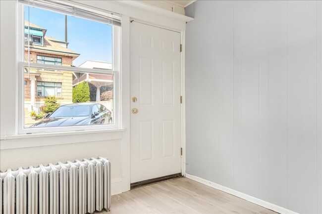 Building Photo - Spacious, Charming Victorian Style Tri-Ple...