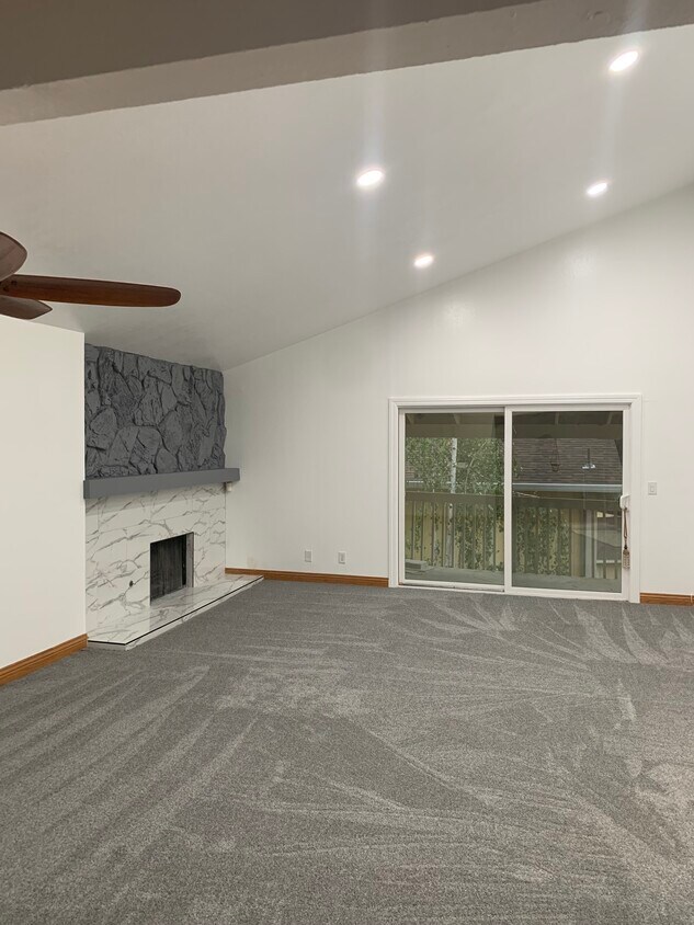 Vaulted living room with balcony - 8751 Mountain Blvd
