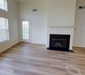 This 1230 square foot home in Stamford, Connecticut offers a blend of comfort and functionality across its two floors. The ground floor, spanning 670 square feet, hosts an open-concept kitchen and living area. The kitchen features white cabinetry, granite countertops, and modern appliances, while the living room boasts a fireplace and high ceilings, creating an airy atmosphere.

The home's three bedrooms, including a 140 square foot primary bedroom, provide ample space for rest and relaxation. The single bathroom is well-appointed with a vanity, large mirror, and a shower/tub combination. Throughout the house, a mix of carpeting and hardwood flooring adds warmth and style.

Large windows and sliding glass doors allow natural light to flood the rooms, enhancing the sense of space. The property also features a hallway and closet for additional storage. With its practical layout and contemporary finishes, this home offers a comfortable living environment in a desirable Stamford location.