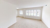 Located at 903 Aintree Park Dr in Mayfield, OH, this 2-bedroom, 1-bathroom unit offers a clean, functional layout across a single floor. The living area is bright and open, featuring plush neutral carpeting, crisp white walls, a textured ceiling, and a large multi-pane bay-style window that frames outdoor greenery and fills the space with natural light. A secondary window adds additional brightness, creating an airy, welcoming atmosphere.

The kitchen stands out with its modern upgrades, including white shaker-style cabinetry, granite-look countertops, light wood-style flooring, and stainless steel appliances. The galley layout maximizes efficiency while maintaining a clean, contemporary aesthetic.

The spacious primary bedroom is generously sized with soft carpeting, ample natural light from a dedicated window, and notable storage provided by two sets of bifold closet doors revealing double closets with built-in rods and shelving. The second bedroom is equally well-lit and comfortable, with carpeted flooring and easy access to the hallway.

The full bathroom features wood-style flooring, a white vanity, a soaking tub with shower, and elegant multi-bulb vanity lighting, rounding out this tidy and thoughtfully updated home in a convenient Mayfield location.
