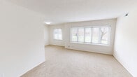 Located at 903 Aintree Park Dr in Mayfield, OH, this 2-bedroom, 1-bathroom unit offers a clean, functional layout across a single floor. The living area is bright and open, featuring plush neutral carpeting, crisp white walls, a textured ceiling, and a large multi-pane bay-style window that frames outdoor greenery and fills the space with natural light. A secondary window adds additional brightness, creating an airy, welcoming atmosphere.

The kitchen stands out with its modern upgrades, including white shaker-style cabinetry, granite-look countertops, light wood-style flooring, and stainless steel appliances. The galley layout maximizes efficiency while maintaining a clean, contemporary aesthetic.

The spacious primary bedroom is generously sized with soft carpeting, ample natural light from a dedicated window, and notable storage provided by two sets of bifold closet doors revealing double closets with built-in rods and shelving. The second bedroom is equally well-lit and comfortable, with carpeted flooring and easy access to the hallway.

The full bathroom features wood-style flooring, a white vanity, a soaking tub with shower, and elegant multi-bulb vanity lighting, rounding out this tidy and thoughtfully updated home in a convenient Mayfield location.