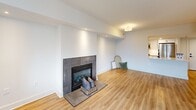 Located on the 17th floor at 1221-1331 S Eads St in Arlington, VA, this one-bedroom, one-bathroom unit offers a thoughtfully designed layout with a clean, modern aesthetic throughout. Warm hardwood-style flooring flows continuously across the open living and dining areas, creating a cohesive and inviting atmosphere. The living room is a standout space, anchored by a tile-surround fireplace and bathed in natural light from large windows and a sliding glass door that opens to a private balcony, providing outdoor views of the surrounding Arlington skyline. The kitchen features white cabinetry with matte black hardware, white countertops, and stainless steel appliances, including a gas range, all set against a crisp, minimalist backdrop. The generously sized primary bedroom offers a bright, open feel with a large window and direct access to the full bathroom and a dedicated closet. The bathroom is well-appointed with a tub-shower combo featuring white tile surround, a white vanity with under-cabinet storage, and a framed mirror. Neutral wall tones and recessed lighting throughout the unit contribute to a bright, airy ambiance, making this a polished and functional home in a prime Arlington location.