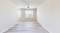 Located at 2400 Linden Dr in Denton, TX, this well-appointed one-bedroom, one-bathroom unit offers a thoughtfully designed single-floor layout that maximizes comfort and functionality. Light wood-style flooring flows consistently throughout every room, lending a clean, cohesive aesthetic to the entire space.

The open-concept kitchen and living area serves as the heart of the unit. The kitchen is outfitted with crisp white cabinetry, granite countertops, a full suite of stainless steel appliances including a refrigerator with ice maker, electric range, microwave, and dishwasher, along with a peninsula that provides additional prep space and casual seating. Recessed lighting illuminates the area effectively.

The spacious bedroom features neutral wall tones, a ceiling fan with light fixture, and windows that invite natural light and offer views of the surrounding neighborhood. A dedicated closet provides ample storage, and the room offers a calm, airy atmosphere.

The bathroom is finished with classic white subway tile surrounding the tub-shower combo, light wood-style tile flooring, a white vanity with granite countertop, and brushed nickel fixtures — creating a clean, timeless look.

Throughout the unit, neutral color palettes, modern finishes, and an efficient layout come together to create a comfortable and contemporary living environment.