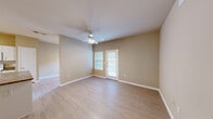 Located at 1409 N Zang Blvd in Dallas, Texas, this single-floor, one-bedroom, one-bathroom residence offers a thoughtfully arranged layout designed for comfortable everyday living. Light wood-style flooring runs throughout, lending a clean, cohesive look to every room.

The living area is bright and open, featuring a ceiling fan with integrated lighting and a private exterior door that brings in natural light. Neutral-toned walls complement the airy feel of the space.

The kitchen is a standout feature, equipped with white cabinetry, dark granite-style countertops, a peninsula island for additional workspace, track lighting overhead, and full white appliances including a refrigerator, stove, and dishwasher. Built-in shelving adjacent to the kitchen provides added storage and display space.

The bedroom is a comfortable size, complete with a ceiling fan, a window overlooking greenery, and access to a walk-in closet with built-in shelving — offering generous storage.

The bathroom includes a full tub-shower combo with white tile surround, overhead cabinetry, and wood-style flooring. A dedicated laundry area accommodates a washer and dryer with overhead shelving and a water heater. Two hallways connect the rooms for a practical and efficient flow throughout the home.