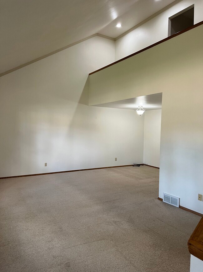Living room with vaulted ceilings, and extra dining or sitting area - 1226 E Longview Dr