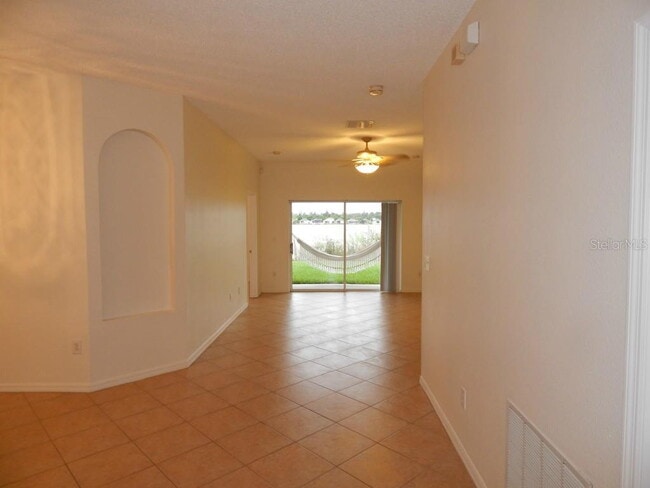 Building Photo - **Charming 4BR/2BA Pond-View Home with Boat Ramp Access – East Orlando **