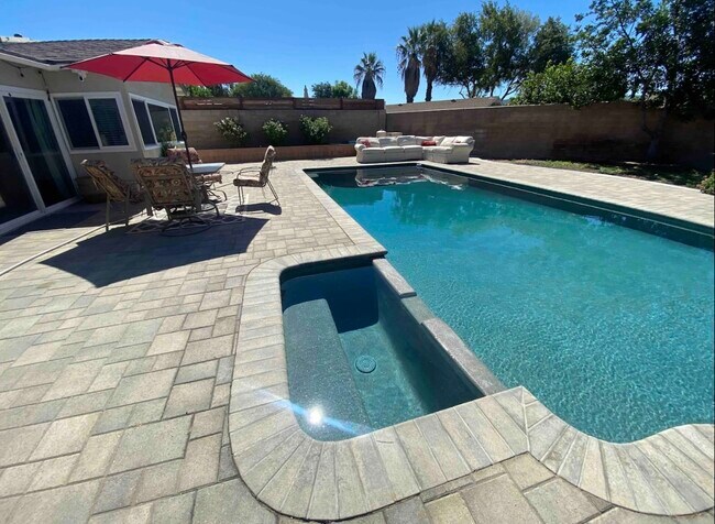 Backyard pool and jacuzzi. - 2330 Collier Ct