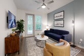 Located at 1521 Lee Rd in Douglasville, GA, this well-appointed one-bedroom, one-bathroom unit offers a smart, efficient single-floor layout designed to maximize comfort and functionality. The open-concept living and kitchen area serves as the heart of the home, where wood-look flooring, recessed lighting, and a ceiling fan create a bright, welcoming atmosphere. Large windows flood the living room with natural light and offer views of lush greenery outside, while a soft blue accent wall adds a modern design touch.

The kitchen is a standout feature, boasting crisp white shaker cabinetry, granite countertops, a classic subway tile backsplash, and a full suite of stainless steel appliances including a refrigerator, range, and built-in microwave. A dining bar with seating bridges the kitchen and living areas seamlessly.

The bedroom offers a comfortable, carpeted retreat with ample space and a dedicated closet. The bathroom is finished with white cabinetry, granite countertops, a large vanity mirror, and a marble-tiled shower surround. A dedicated laundry room with an in-unit Whirlpool washer and dryer adds everyday convenience, rounding out this well-designed Douglasville residence.