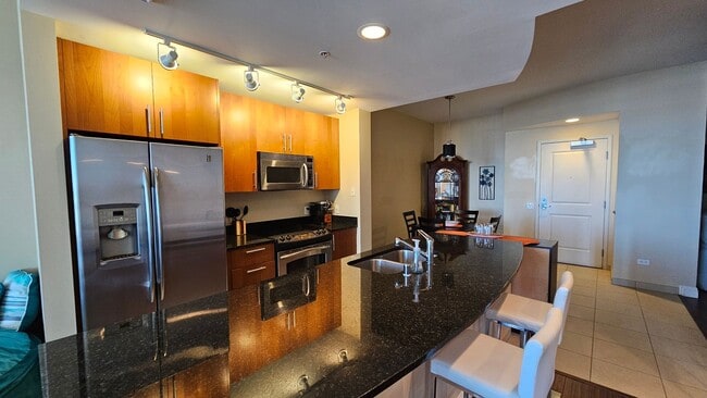 Building Photo - ***GORGEOUS FURNISHED 1 BEDROOM CONDO AT A...