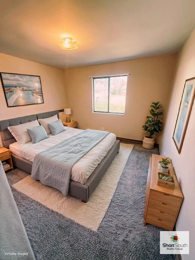 Building Photo - Updated 2 bed 1 bath main floor apartment with covered detached garage