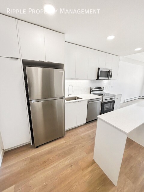 Photo du bâtiment - MODERN 1-BED CONDO | BELVEDERE PREMIER LIVING | SLEEK FINISHES