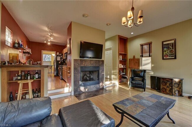 Family room with clean gas fireplace - 2188 W 6th St