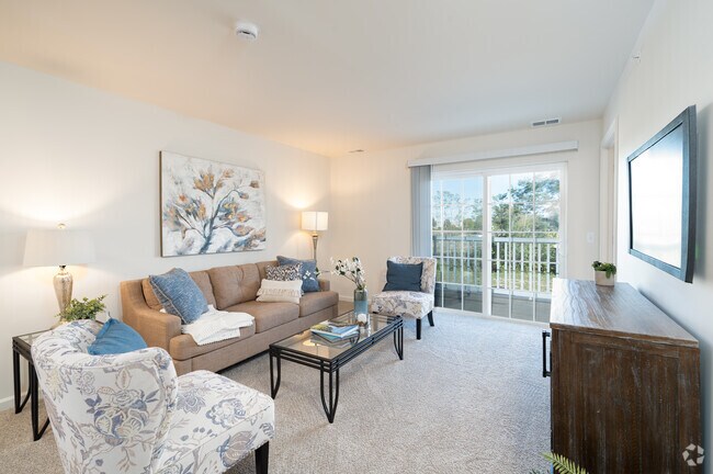 2 habitaciones, 1 baño - 865 pies cuadrados - Sala de estar - Fishers Run Senior Apartments