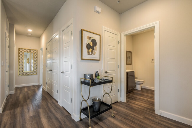 Hallway to Bedrooms at back of villa w/spare bath off greatroom/living area - 9735 Montclaire Dr