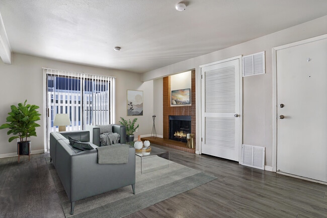 Living Room with Fireplace - Aspen Village Apartment Homes