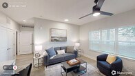 Located at 5341 Arrival Drive in Raleigh, NC, this well-appointed one-bedroom, one-bathroom residence offers a thoughtfully designed open-concept layout with modern finishes throughout. Light-toned luxury vinyl plank flooring flows through the main living areas, creating a cohesive and clean aesthetic.

The kitchen serves as the heart of the home, boasting sage-green shaker-style cabinetry, white subway tile backsplash, and light quartz countertops. Stainless steel appliances — including a range, microwave, and dishwasher — complement the space, while a large center island with pendant lighting and bar seating provides both additional prep space and casual dining functionality.

The living room is bright and inviting, featuring a ceiling fan, recessed lighting, and a generously sized window fitted with blinds that allow for ample natural light and outdoor views.

The bedroom offers a comfortable, carpeted retreat with a ceiling fan, large window with outdoor greenery views, and convenient access to additional storage.

The bathroom is spacious and elongated, finished with wood-look flooring, a stone-topped vanity with shaker-style cabinetry, and a shower-tub combination. The neutral palette and clean lines throughout give the entire residence a fresh, contemporary feel.