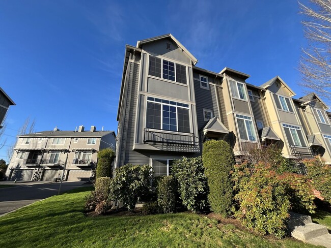 Building Photo - Thoughtfully Designed Three-Bedroom Home on a Corner Lot with Private Lower-Level Bedroom and Ens...