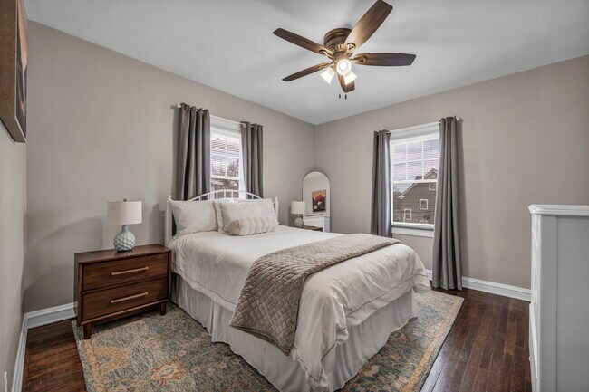 This bedroom boasts a queen-size mattress of hotel-quality, ensuring an exceptional sleep experience - 3386 Westbury Rd