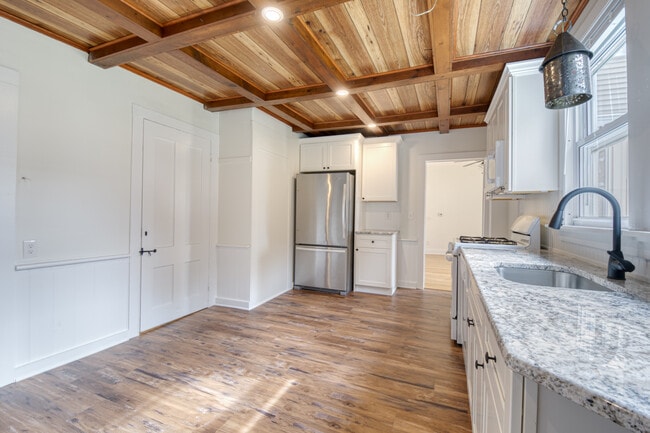 Spacious kitchen with new appliances, flooring, cabinetry and countertops - 15 Mountain St