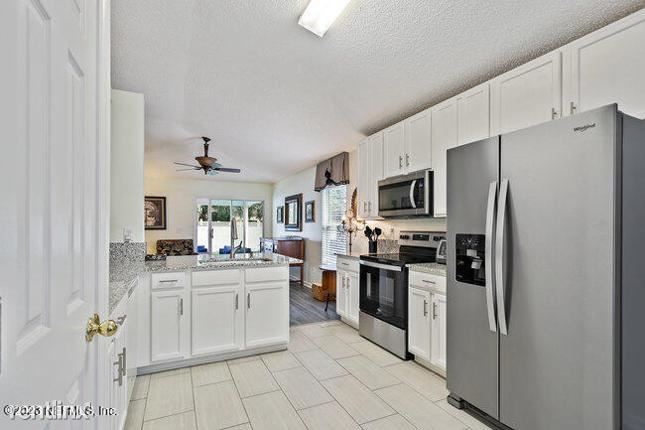 Building Photo - 4 br, 2 bath House - 850 S Lilac Loop