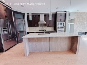 Building Photo - 2117-2151 51 Ave SW