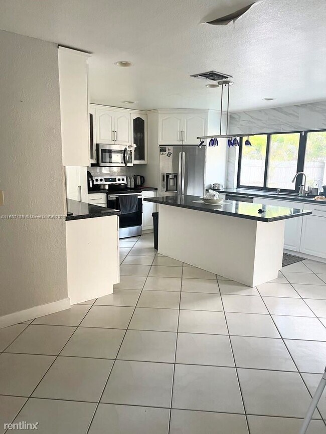 Foto del edificio - 4 br, 2 bath House - 7363 NW 49th Ct # 7363