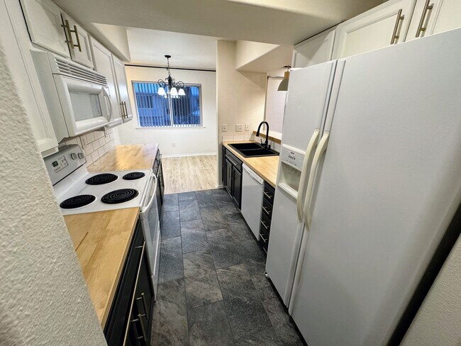 Kitchen - facing dining - 7059 Fairweather Park Loop