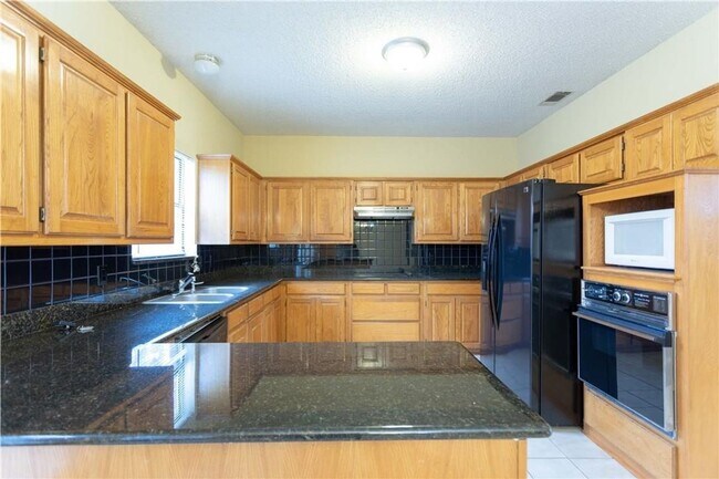 Building Photo - Four bedroom home in a nice location. Well...