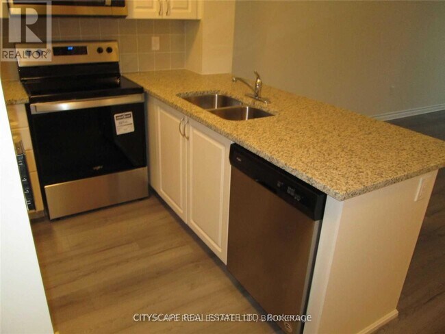 Photo du bâtiment - 349-1349 Rathburn Rd W
