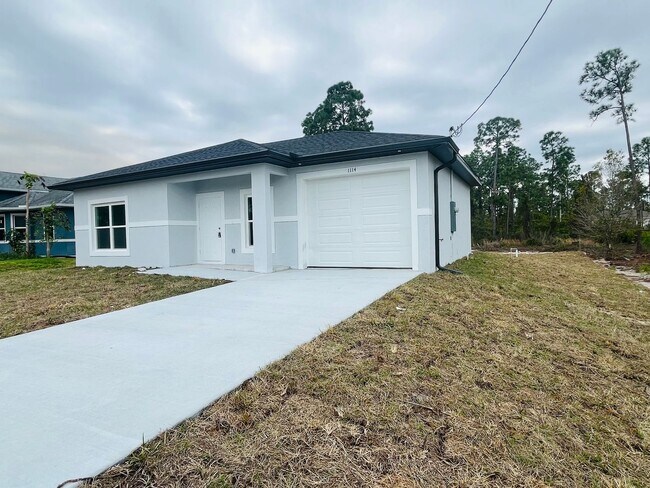 Building Photo - Brand-New Modern 2BR/2BA Home with Garage – Desirable Lehigh Acres Location
