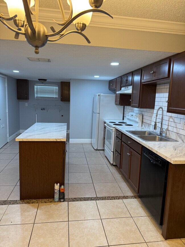Spacious kitchen with island - 7261 Pond Cir