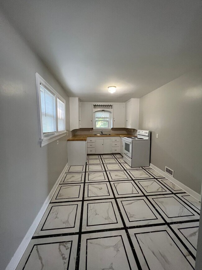 Building Photo - Step into charm, comfort, and a fresh remo...