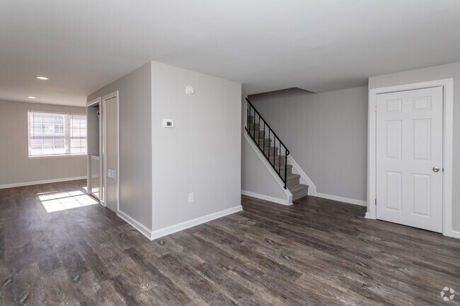 3BR, 1.5BA - 1,100SF - Living Room - Village Of Carrollwood Townhomes
