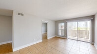 Located at 8791 Hammerly Blvd in Houston, Texas, this single-story, 3-bedroom, 2-bathroom home offers a practical and well-organized layout. Warm-toned ceramic tile flooring runs consistently throughout every room, lending a cohesive and easy-to-maintain aesthetic across the entire space.

The galley-style kitchen is efficiently designed with ample white cabinetry featuring gold hardware, light granite-style countertops, a stainless steel sink, and a full suite of stainless steel appliances including a refrigerator, range, microwave, and dishwasher. Track lighting overhead brightens the workspace.

The three bedrooms are finished in neutral gray tones with clean white trim and baseboards. The primary bedroom is a comfortable size and connects to a dedicated walk-in closet equipped with wire shelving and hanging rods. Additional bedrooms are well-proportioned, each with windows fitted with horizontal blinds that allow natural light and outdoor views. A second closet provides further storage.

Both bathrooms are identically appointed with tub/shower combo units, brushed nickel fixtures, light tile flooring, and neutral wall tones. The overall design of the home is clean, understated, and move-in ready, making it a functional and comfortable residence in the Houston area.