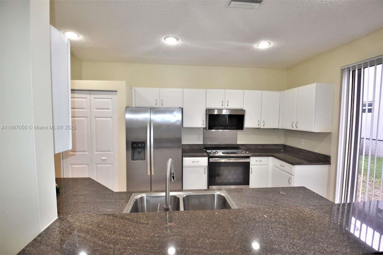 Photo - 6161 Northwest 58th Way Apt #6161, Parkland, FL 33067 - 4 BR 3 BA single-family home
