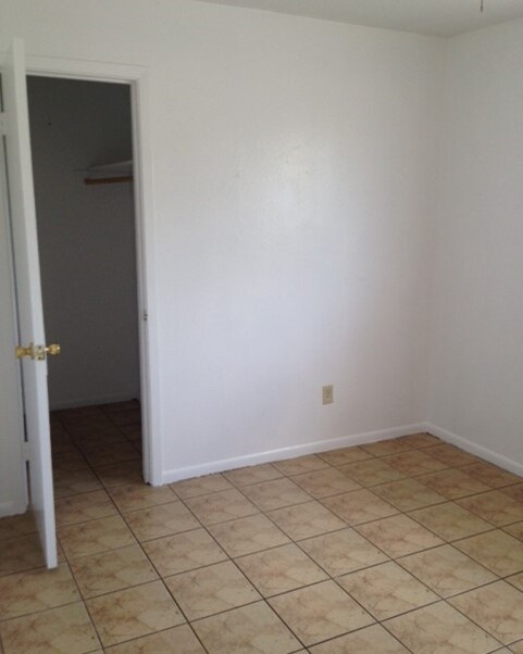 Bedroom #2 - Walk-in closet with light, ceiling fan with light fixture, tile - 2319 Leaman Ave