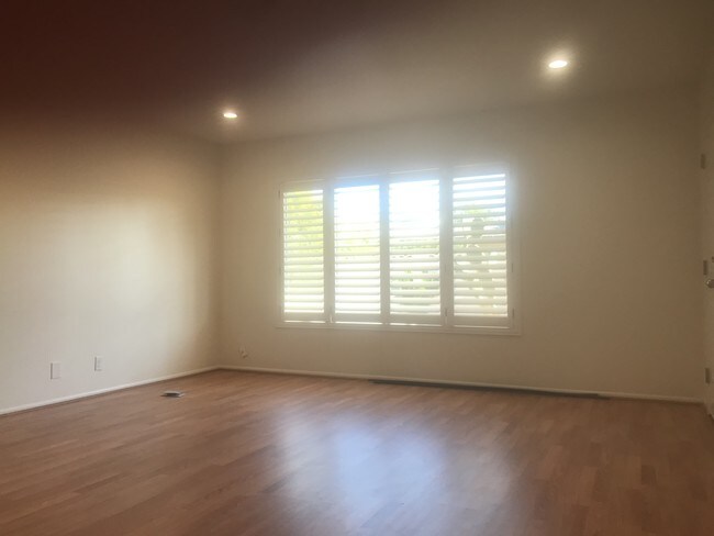 living room w/plantation shutters - 3640 E Montecito Ave