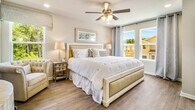 This charming 1,230 square foot home in Orange Beach, Alabama, offers a perfect blend of coastal living and modern comfort. Spread across two floors, the property features three bedrooms and three bathrooms, making it an ideal retreat for families or groups.

The interior design embraces a coastal theme, with light, airy spaces and beach-inspired decor. The open-concept living area on the main floor combines the living room, dining room, and kitchen, creating a seamless flow for entertaining. Large windows allow natural light to flood the space, enhancing the bright and welcoming atmosphere.

The kitchen boasts white cabinetry, granite countertops, and stainless steel appliances, offering both style and functionality. A spacious island provides additional counter space and casual seating.

The bedrooms are thoughtfully decorated, with the primary suite measuring 180 square feet. Comfortable furnishings, coastal artwork, and ample storage space ensure a relaxing retreat. The bathrooms feature modern fixtures and clean lines, maintaining the home's contemporary feel.

Throughout the house, hardwood floors, recessed lighting, and ceiling fans add to the overall comfort and aesthetic appeal. The property's layout and design make efficient use of its 1,230 square feet, with 580 square feet on the ground floor and 650 square feet on the upper level.

Located in the desirable Gulf Stream area of Orange Beach, this home offers the perfect balance of beachside living and modern conveniences, making it an attractive option for both permanent residents and vacation home seekers.