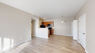 Located at Hartford Village in Columbus, OH, this one-bedroom, one-bathroom unit offers a practical and comfortable single-floor layout. The open-concept living and kitchen area is anchored by light wood-style flooring that extends throughout the main living spaces, creating a bright and cohesive atmosphere. Large sliding glass doors in the living room allow natural light to pour in and provide access to an outdoor area.

The kitchen is efficiently designed with warm honey-toned cabinetry, granite-style countertops, and a full suite of black appliances including a refrigerator, electric range, built-in microwave, and dishwasher. A peninsula with a double sink separates the kitchen from the living space, adding both functionality and definition to the layout.

The bedroom is a generously sized, carpeted retreat featuring a window with natural light and ample wall space. A dedicated closet provides convenient storage. The full bathroom includes a wood-toned vanity with a granite-style countertop, a full tub-shower combination, and light wood-style flooring consistent with the rest of the unit.

A dedicated laundry area with hookups adds everyday convenience. Neutral warm-beige walls throughout give the space a clean, move-in-ready feel suited for a variety of interior styles.