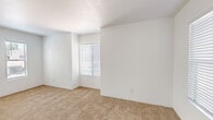 Located at 4250 E Busby Dr in Sierra Vista, Arizona, this two-bedroom, two-bathroom single-floor home offers a clean, functional layout designed for comfortable everyday living. The interior features a neutral color palette of crisp white walls and warm beige carpeting throughout the living areas and bedrooms, creating a bright and cohesive aesthetic.

The living room provides a welcoming, open area with a window fitted with blinds that allows natural light to filter in. A glimpse into the adjacent kitchen reveals white cabinetry, offering practical storage solutions.

Both bedrooms are carpeted and well-lit, each featuring windows with blinds that bring in ample natural light. The primary bedroom offers a comfortable footprint with access to a closet. The second bedroom is similarly appointed, making it suitable as a guest room, office, or additional sleeping space.

The two bathrooms are finished with light wood-look flooring, white cabinetry with brushed nickel hardware, and clean white fixtures. One bathroom includes a tub-shower combination with tiled surround, while the other features a vanity with an integrated sink and generous counter space.

A hallway connects the main areas of the home, contributing to an efficient and easy-to-navigate floor plan. Overall, the space presents a tidy, move-in-ready environment in a residential Sierra Vista neighborhood.