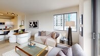 Located on S Federal Highway in Hollywood, FL, this well-appointed 2-bedroom, 2-bathroom residence offers a thoughtfully designed single-level layout with modern finishes throughout. Light wood flooring flows seamlessly across all living areas, creating a warm and cohesive aesthetic.

The open-concept living room is bright and airy, featuring large windows and a floor-to-ceiling glass door that invite abundant natural light and frame sweeping city views of the Hollywood skyline. The kitchen is outfitted with two-tone cabinetry — warm wood lower cabinets paired with high-gloss white uppers — a herringbone tile backsplash, quartz countertops, and stainless steel appliances.

The spacious primary bedroom offers a generous footprint, light-filled windows with city views, light wood flooring, and access to a closet. The second bedroom is equally comfortable, featuring a large window and its own closet. Both bathrooms are finished with large-format white subway tile, soaking tub-shower combinations, wood-grain vanities with white quartz countertops, and illuminated mirrors. A hallway connects the bedrooms and provides access to three closets, adding ample storage. The overall ambiance is clean, contemporary, and bright throughout.