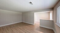 Located at 2900 Knights Rd in Bensalem, PA, this well-appointed two-bedroom, one-bathroom unit offers a thoughtfully designed single-floor layout with clean, modern finishes throughout. The living room is a welcoming, open space featuring light-toned luxury vinyl plank flooring, neutral walls, and a large window fitted with blinds that invite natural light and outdoor views. The space flows into the kitchen area, which is outfitted with a two-tone cabinetry design — crisp white upper cabinets paired with rich dark wood lower cabinets — complemented by light countertops and recessed lighting overhead. Both bedrooms are generously sized and finished with plush wall-to-wall carpeting. The spacious primary bedroom features dual windows for abundant natural light, as well as a closet with sliding doors. The second bedroom also includes a closet and a window with outdoor views, creating a bright and comfortable retreat. The full bathroom is finished with large-format tile flooring, a tiled tub-surround, a window for natural ventilation, and gold-toned hardware accents. Throughout the unit, bright white trim and a cohesive neutral color palette create a clean, modern ambiance that is both functional and inviting.