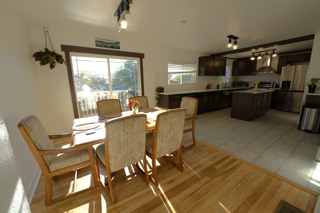 dining area with backyard entrance and kitchen - 1340 Rayburn Dr