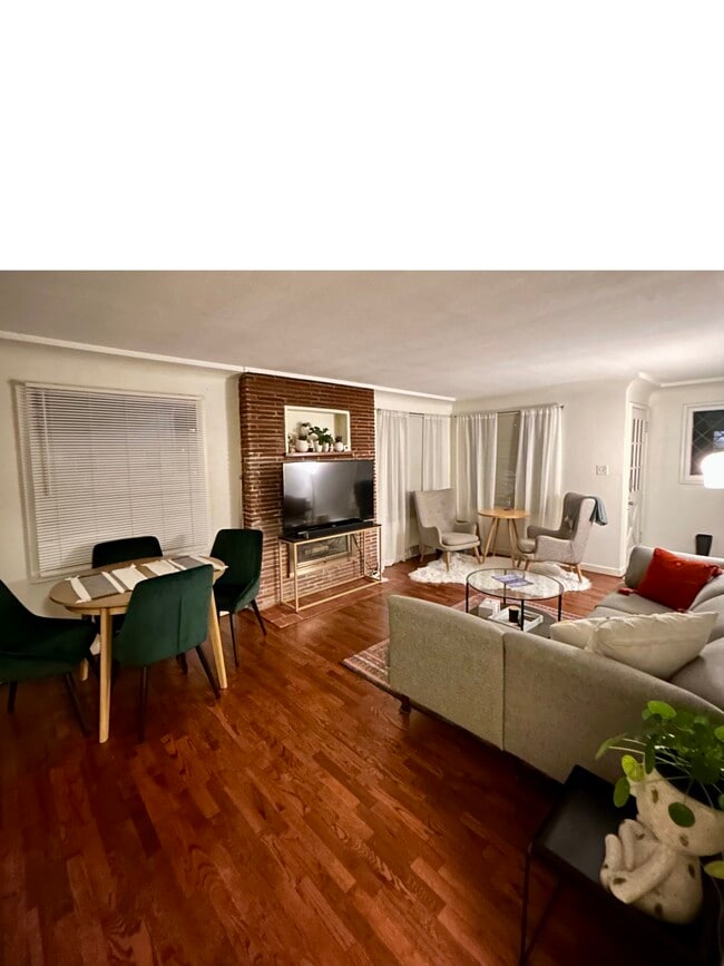 Living space, fireplace, large windows - 2020 N Alder St