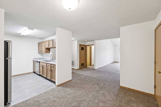 Our open-concept layouts make entertaining effortless, blending kitchen and living spaces for a warm, inviting atmosphere. - Northbrook Apartments