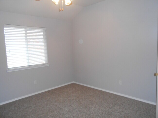Second Guest Bedroom with wooden window blinds, new carpet, ceiling fan and closet - 6928 Prairie Dawn Ln
