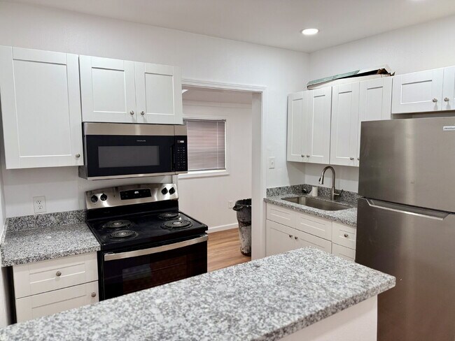 Building Photo - Unbeatable Location: Modern Living Steps f...