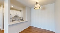Located along Mobile Ave (Lakeshore) in Port Arthur, TX, this single-story residence offers four bedrooms and two bathrooms within a thoughtfully arranged floor plan. The interior showcases warm wood-look flooring that flows consistently throughout, complemented by crisp white walls and clean lines that give the home a bright, contemporary feel.

The kitchen features white cabinetry with gold-toned hardware, a decorative tile backsplash, white appliances, and a stainless steel sink. A pass-through counter connects the kitchen to the dining area, which is accented by a stylish pendant light fixture overhead.

The living room is spacious and welcoming, equipped with a ceiling fan and sliding glass doors that open to outdoor views, allowing ample natural light to fill the space. Additional bedrooms are well-proportioned, each featuring ceiling fans, and windows with blinds that bring in natural light while maintaining privacy.

Both bathrooms are finished with a cohesive, modern design, showcasing vertically laid white subway tile surrounds in the tub/shower combinations, white vanities with light countertops, brushed nickel fixtures, and wood-look flooring. The overall ambiance of the home is clean, functional, and move-in ready, with consistent finishes that provide a polished, cohesive look throughout every room.