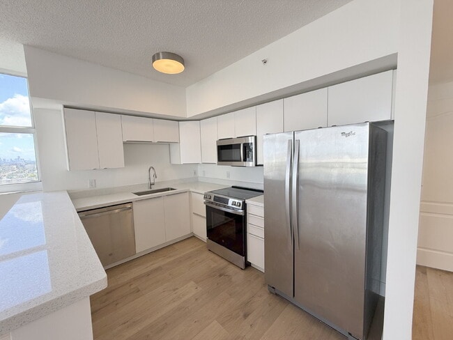 Photo - Rare 2/2 Corner Penthouse with Panoramic Lagoon Views from Every Room – Available Now!