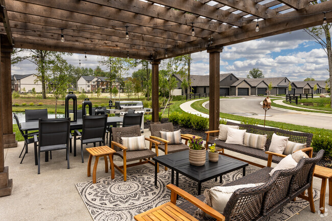 Clubhouse outdoor patio and grilling station - The Residences at Eastwood